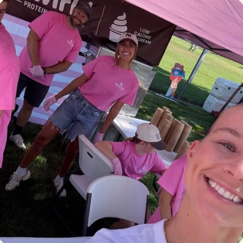 The Swirld team serving guests at the pink trailer